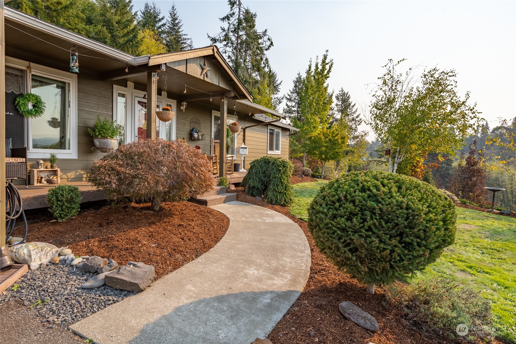 526 Haywire Road Napavine, WA 98532 - Photo 3 of 40 a backyard of a house with a garden and plants