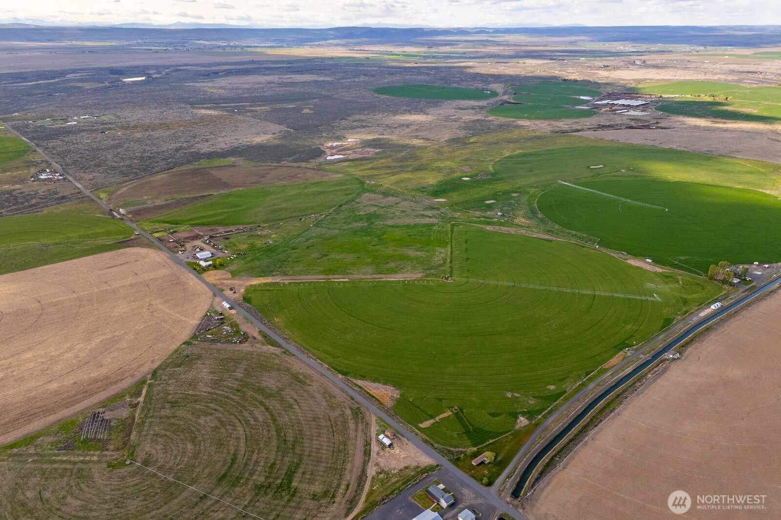 10701 12 Road Northeast Moses Lake, WA 98837 - Photo 24 of 33 a view of a field with an outdoor space