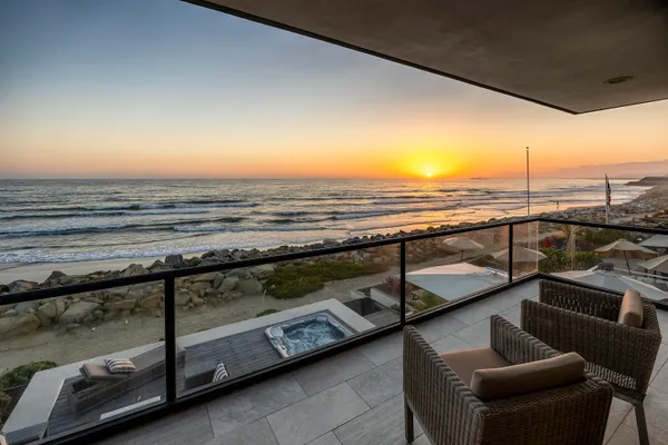 a view of a balcony with ocean view