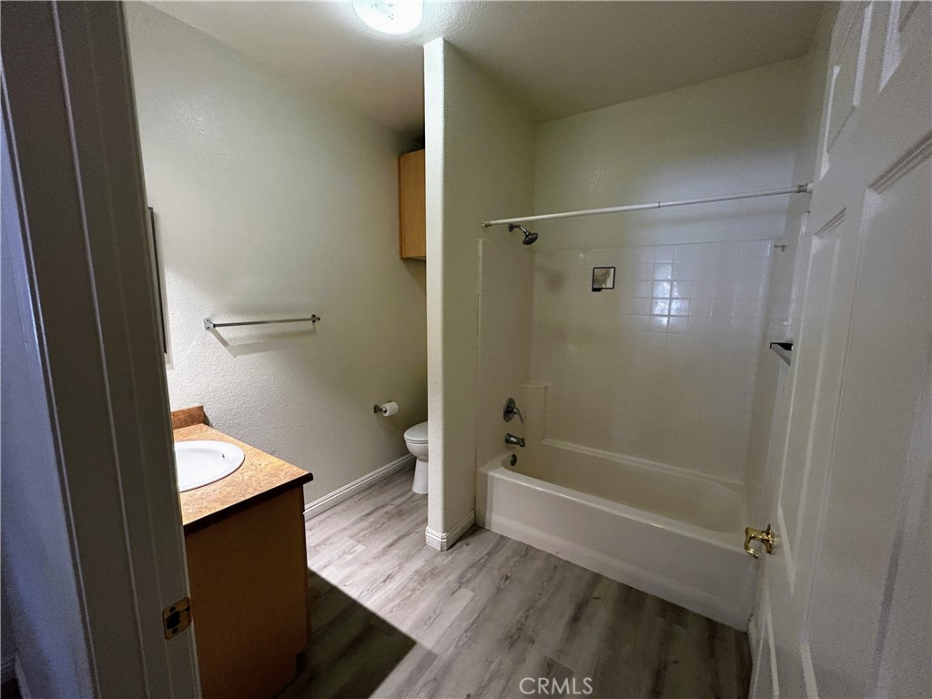 24909 Madison, Unit 111 Murrieta, CA 92562 - Photo 13 of 25 a bathroom with a tub shower vanity and a sink