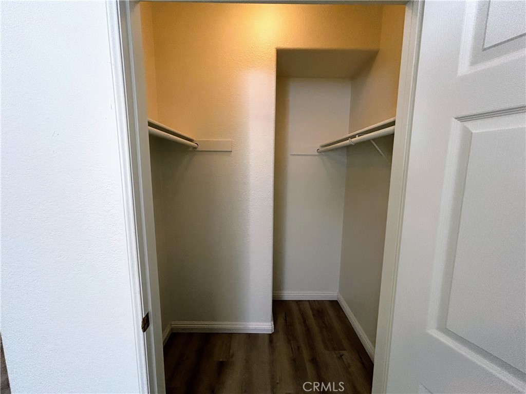 24909 Madison, Unit 111 Murrieta, CA 92562 - Photo 17 of 25 a view of walk in closet with empty racks