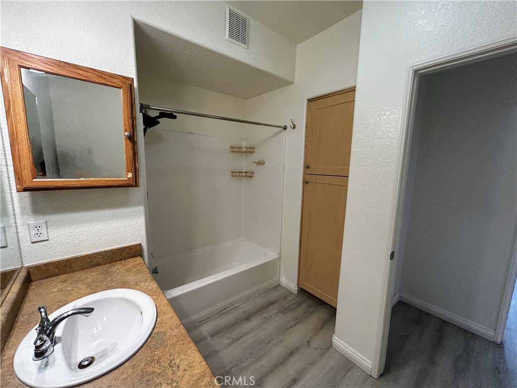24909 Madison, Unit 111 Murrieta, CA 92562 - Photo 19 of 25 a bathroom with a sink and a mirror