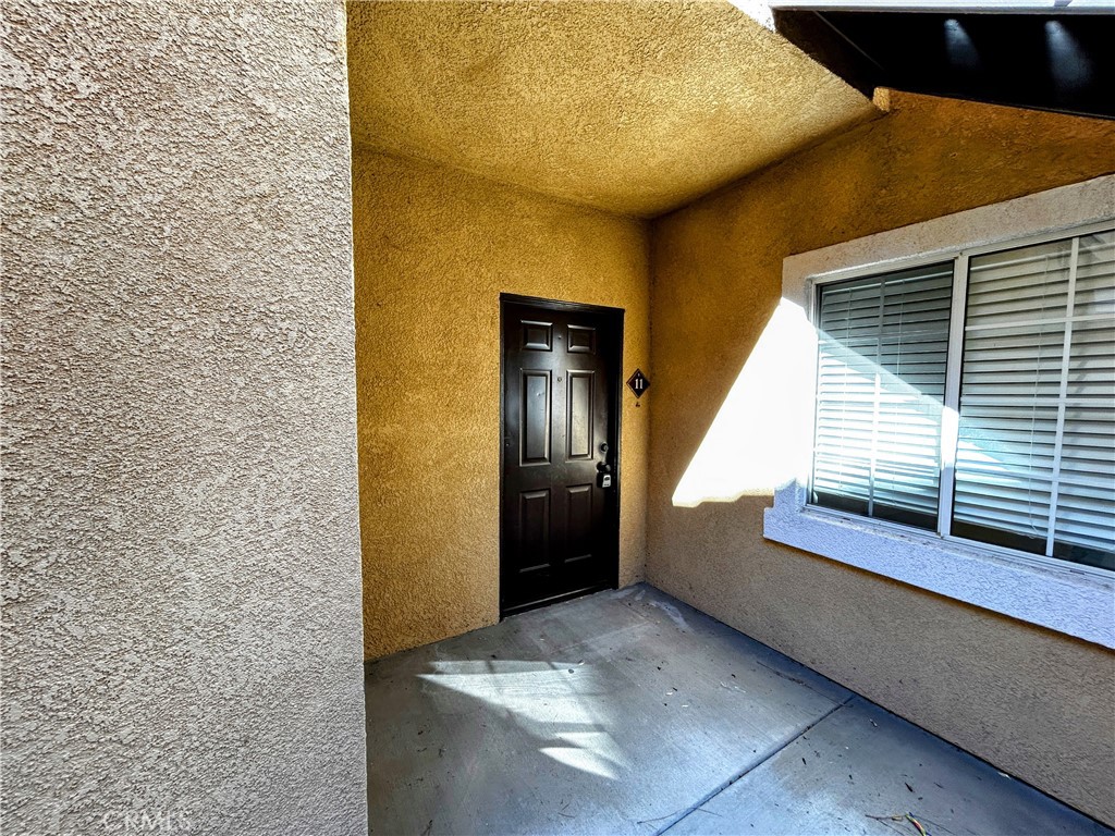 24909 Madison, Unit 111 Murrieta, CA 92562 - Photo 2 of 25 a view of an entryway