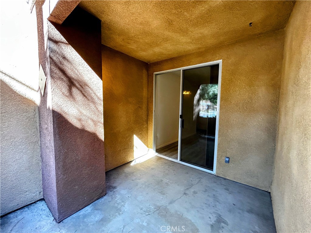 24909 Madison, Unit 111 Murrieta, CA 92562 - Photo 22 of 25 a view of a hallway with wooden shelves