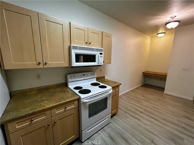 a kitchen with a stove and a microwave