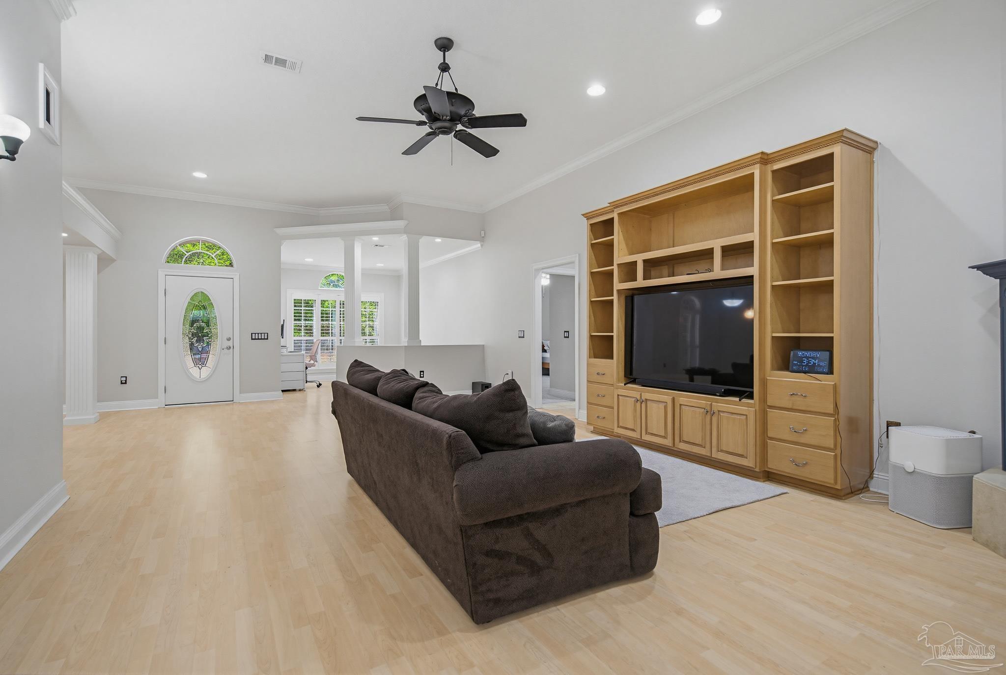 2855 Walling Road Milton, FL 32570 - Photo 15 of 55 a living room with furniture and a flat screen tv