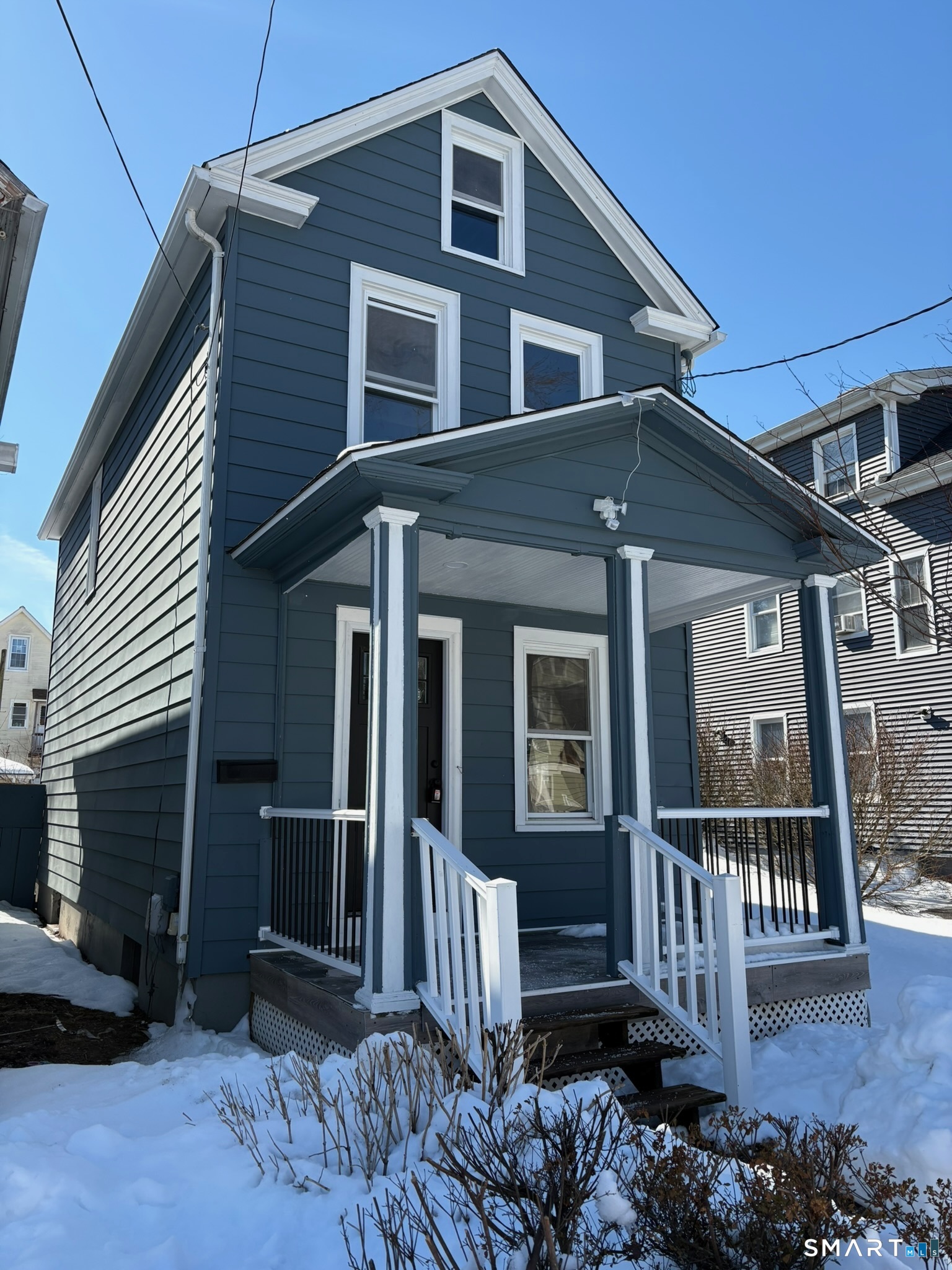 50 Collins Street Hamden, CT 06514 - Photo 1 of 1 a front view of a house with wooden fence