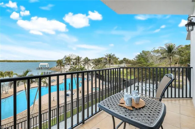 a view of a balcony with two chairs