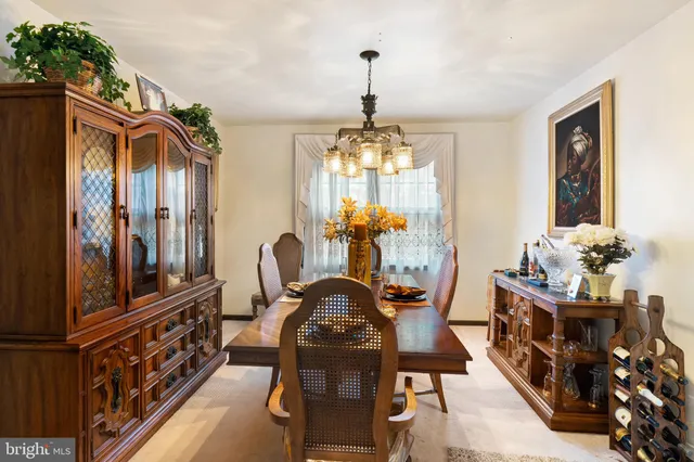a view of a roof deck with table and chairs with wooden floor and fence