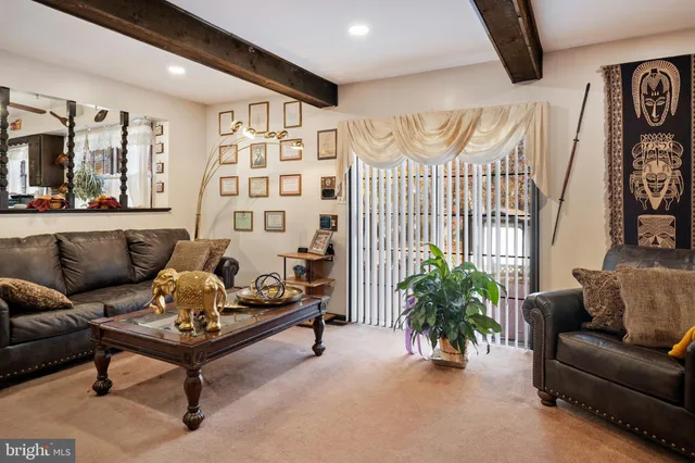 a bathroom with a sink a toilet and shower curtain