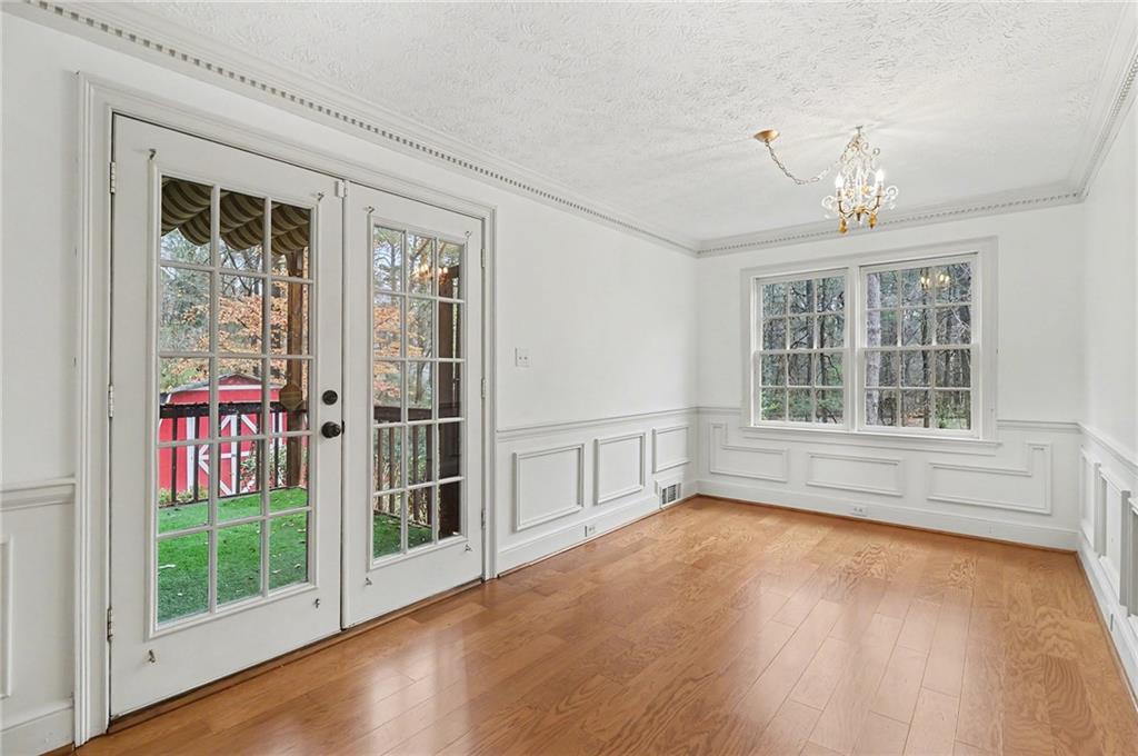 2981 Wilsons Crossing Court Decatur, GA 30033 - Photo 7 of 24 a view of an empty room with a window and wooden floor