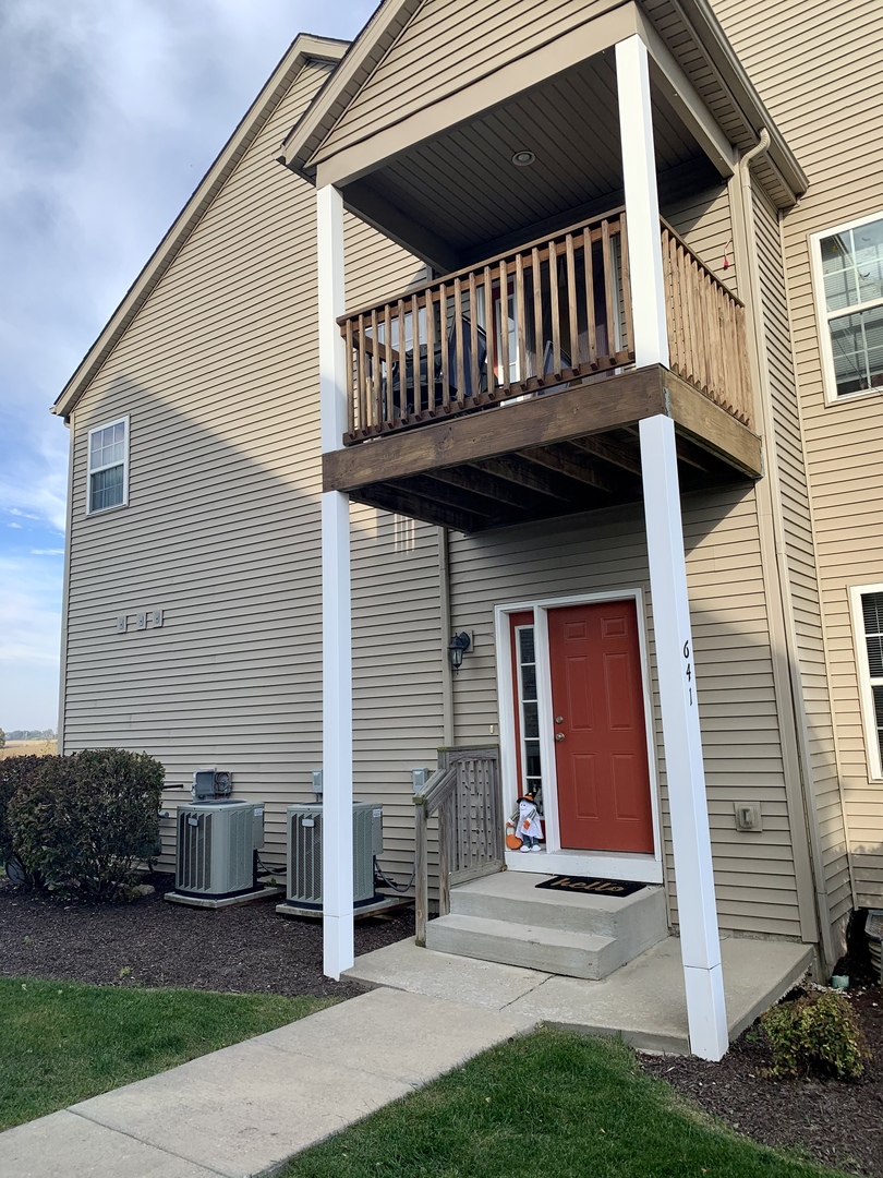 641 Stonegate Drive, Unit 641 Sycamore, IL 60178 - Photo 1 of 13 a view of a house with a yard