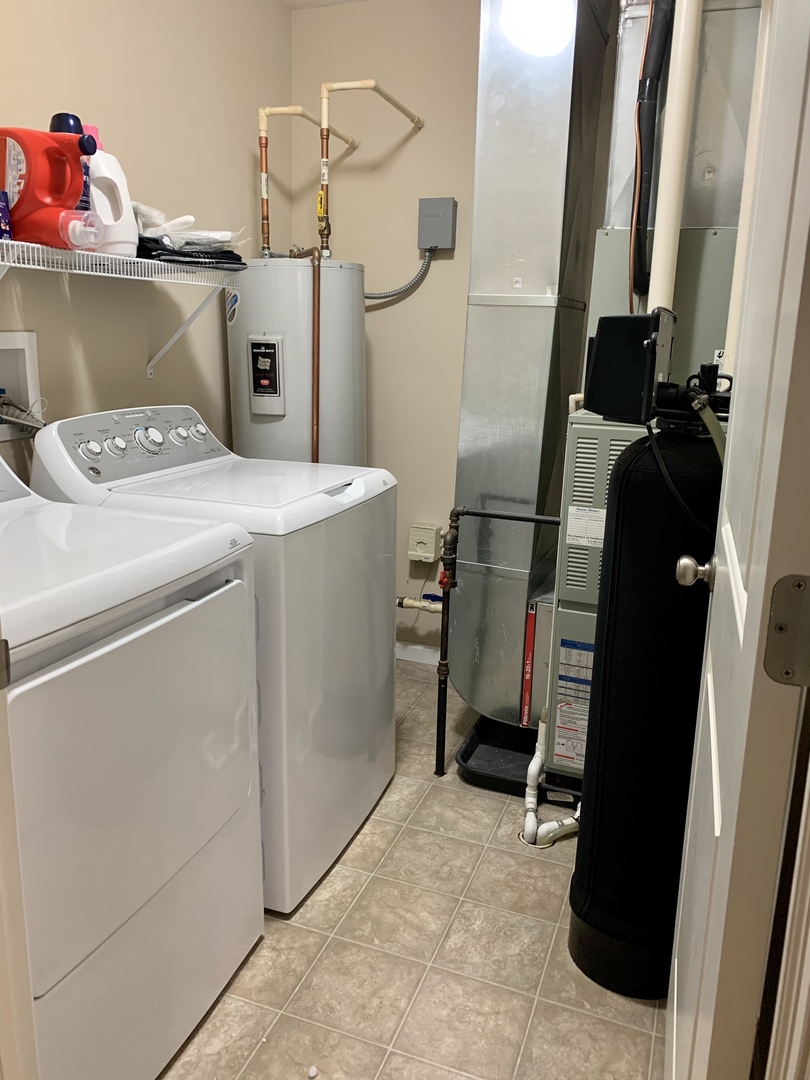 641 Stonegate Drive, Unit 641 Sycamore, IL 60178 - Photo 11 of 13 a utility room with dryer and washer