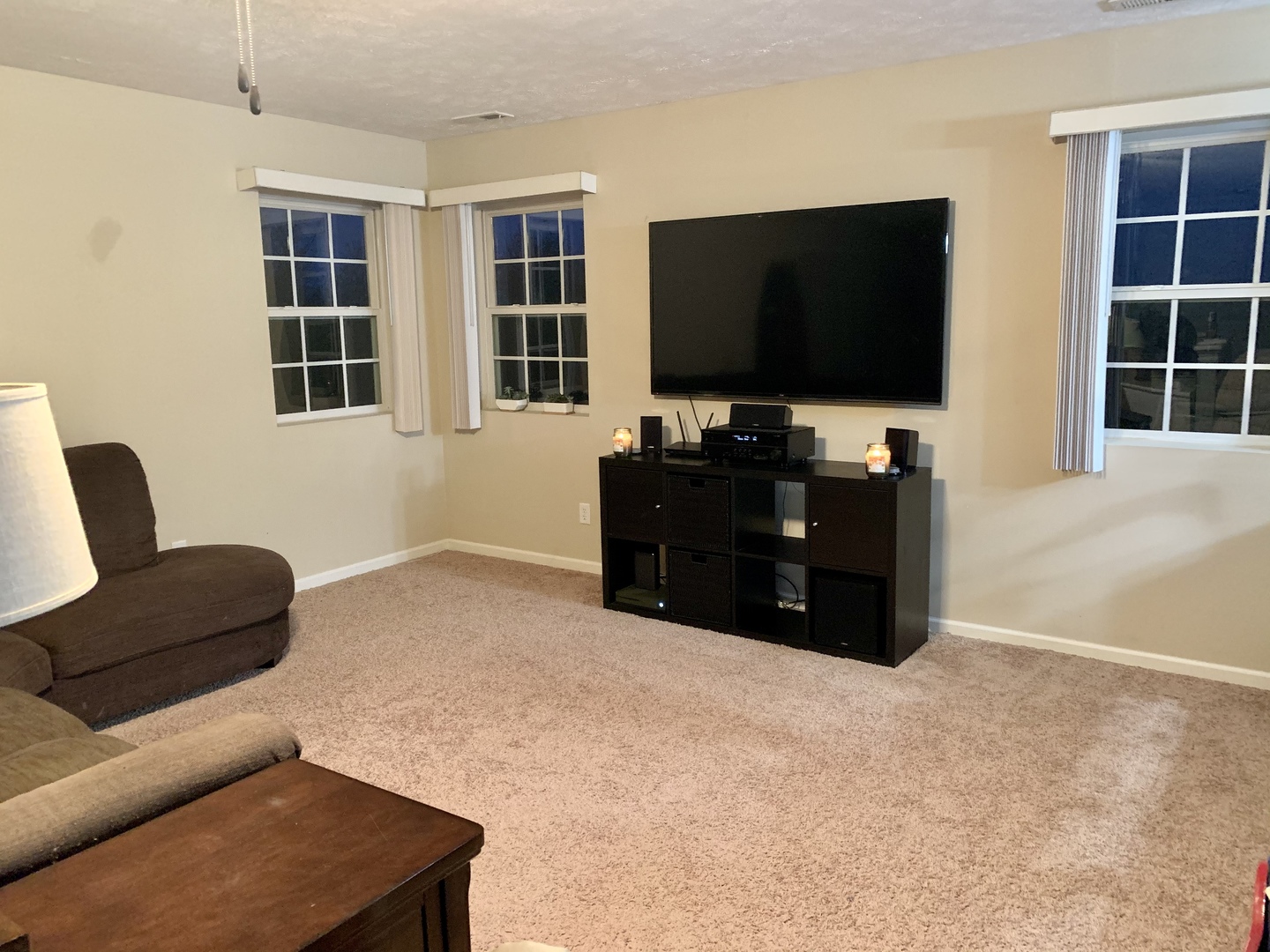 641 Stonegate Drive, Unit 641 Sycamore, IL 60178 - Photo 3 of 13 a living room with furniture and a flat screen tv