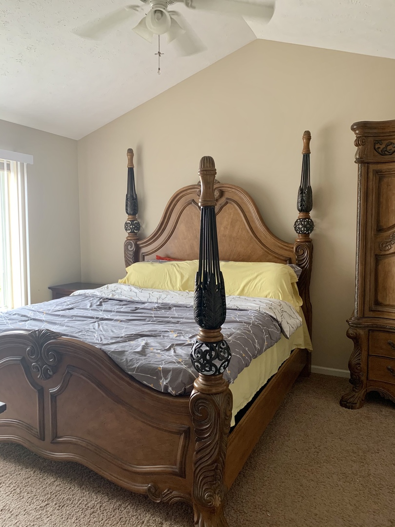 641 Stonegate Drive, Unit 641 Sycamore, IL 60178 - Photo 8 of 13 a bedroom with a bed and window