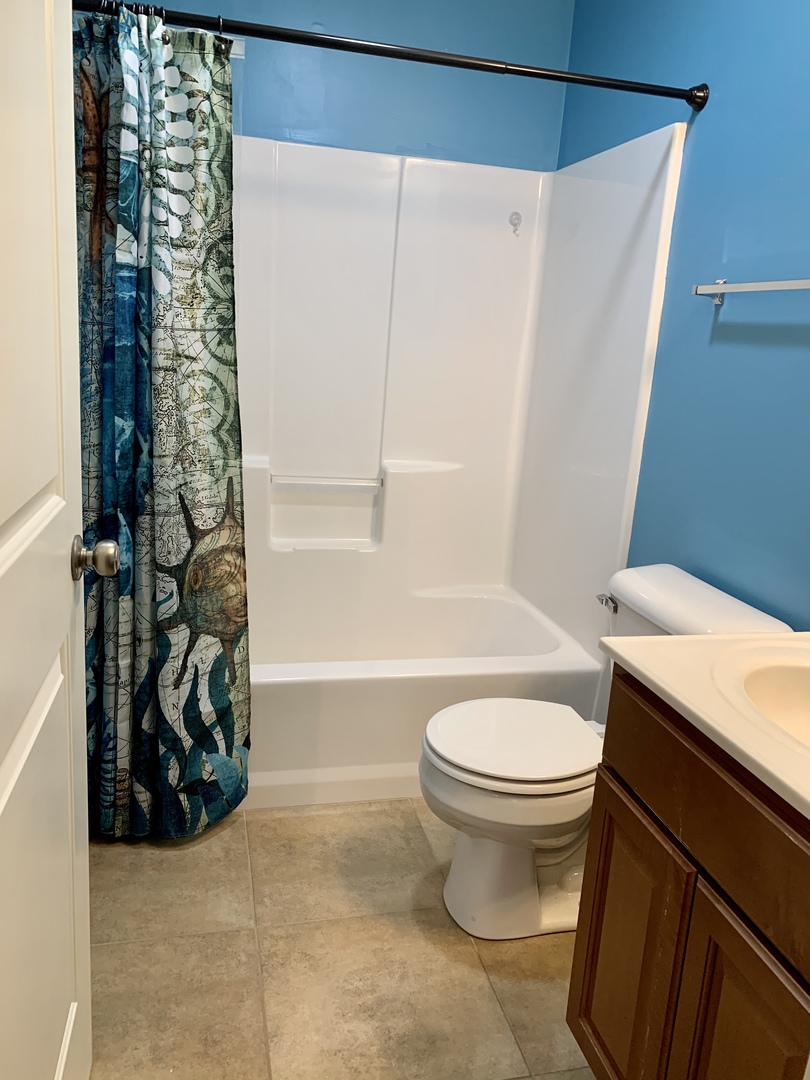 641 Stonegate Drive, Unit 641 Sycamore, IL 60178 - Photo 9 of 13 a bathroom with a toilet and a shower