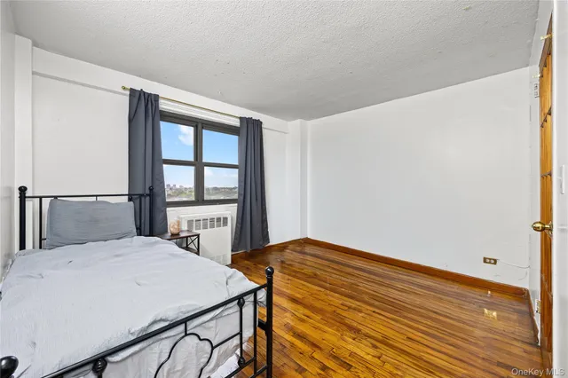 a bedroom with a bed and a table