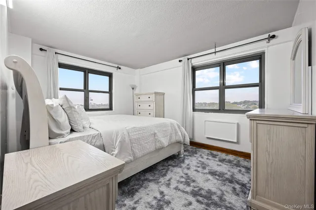 a bedroom with bed and a window