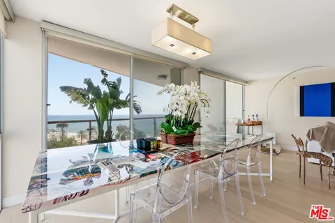 a view of a living room and a balcony