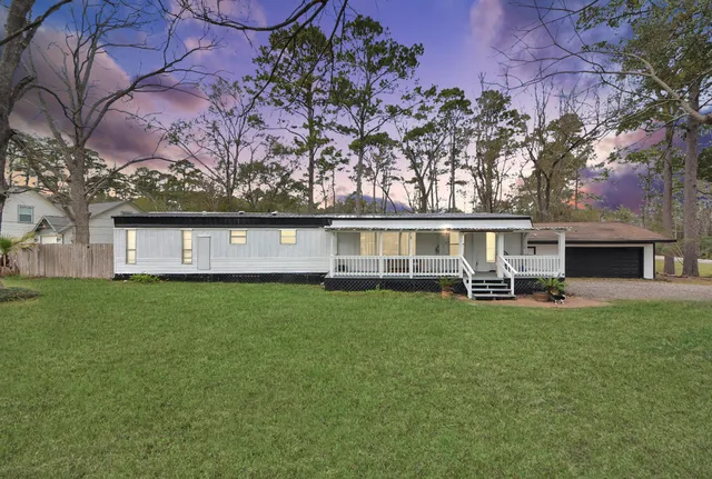a view of a house with a garden