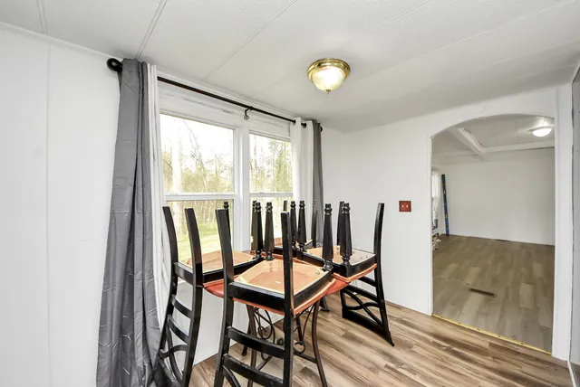 a view of a chairs and table in a room