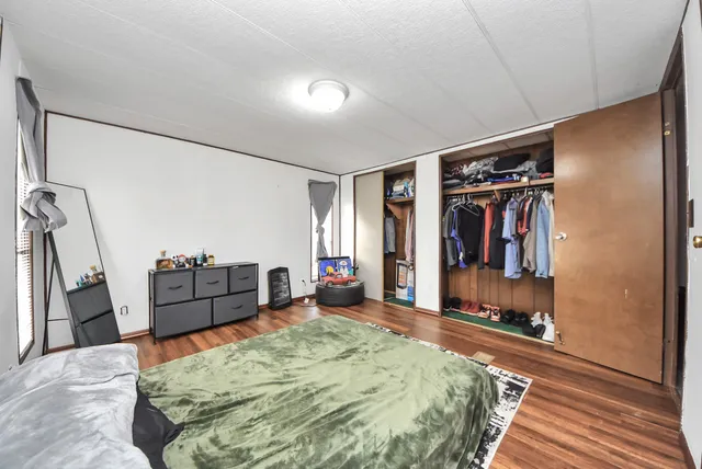 a bed room with a bed and a walk in closet