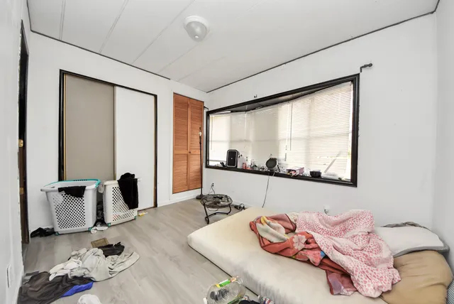 a living room with furniture and floor to ceiling window