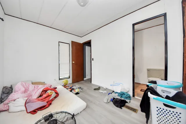 a living room with furniture and white walls