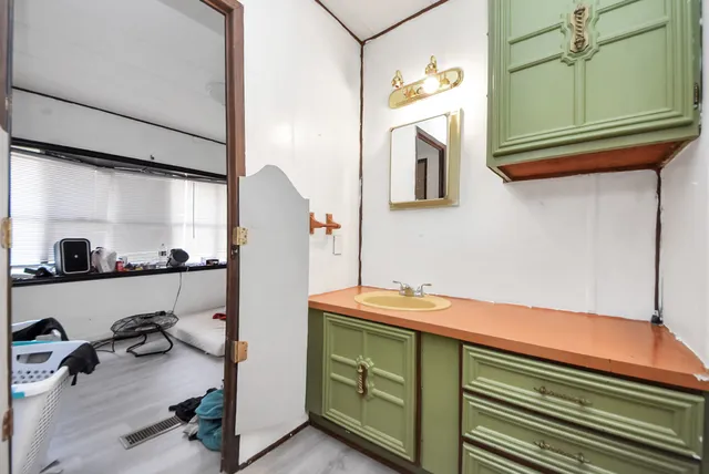 a room with cabinets and a wooden floor