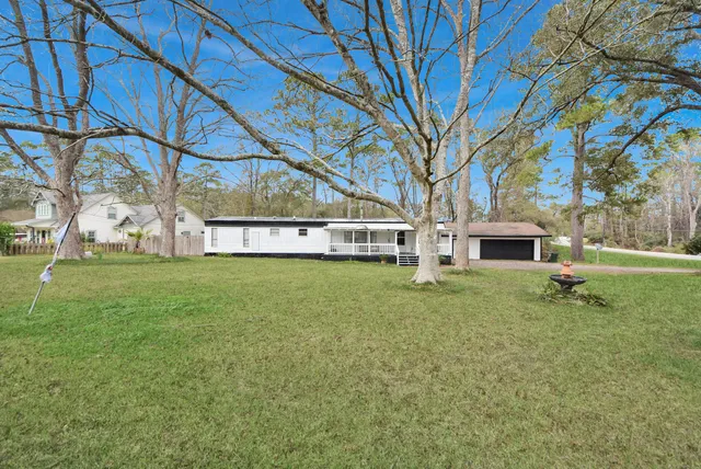 a house with a tree in front of it