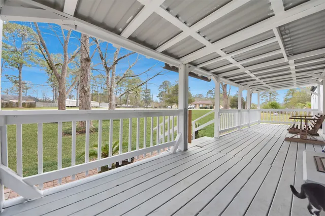 a view of a balcony with wooden floor