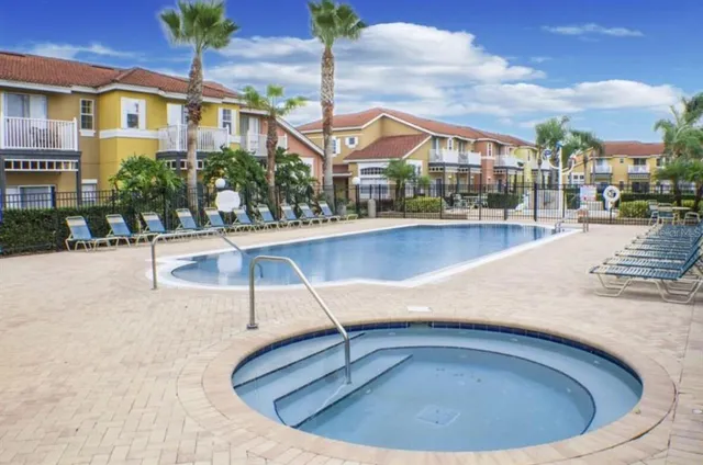 a view of a house with swimming pool