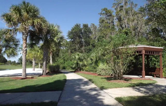 a view of a lake with houses in the background