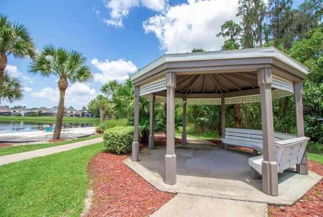 a view of a swimming pool with an outdoor space and seating area