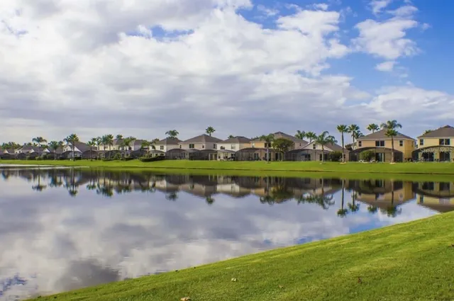 a view of a water pond with green space