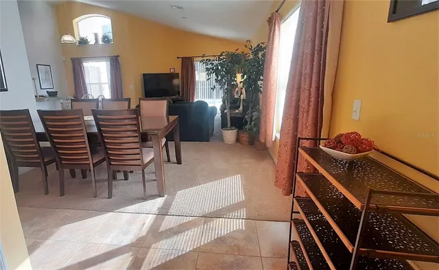 a view of a livingroom with furniture and a flat screen tv