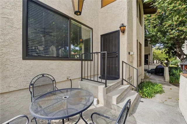a view of a door with tree in front of it