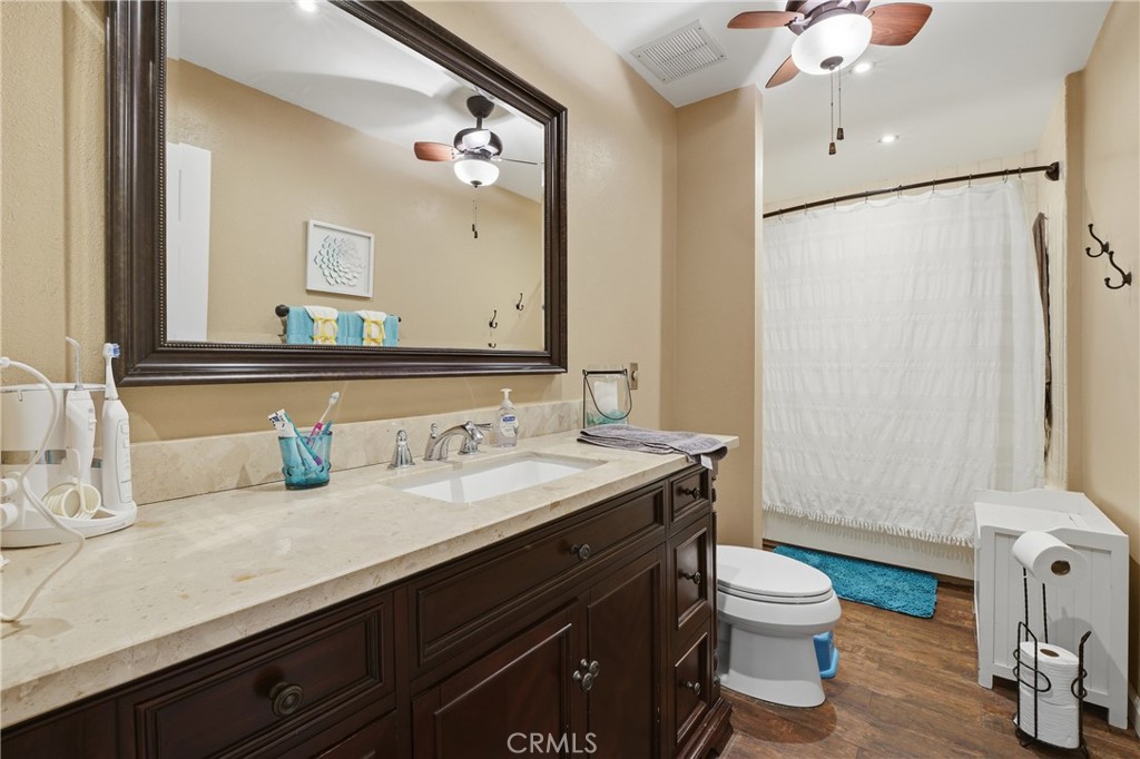 400 South Flower, Unit 99 Orange, CA 92868 - Photo 8 of 14 a bathroom with a sink a toilet and a mirror