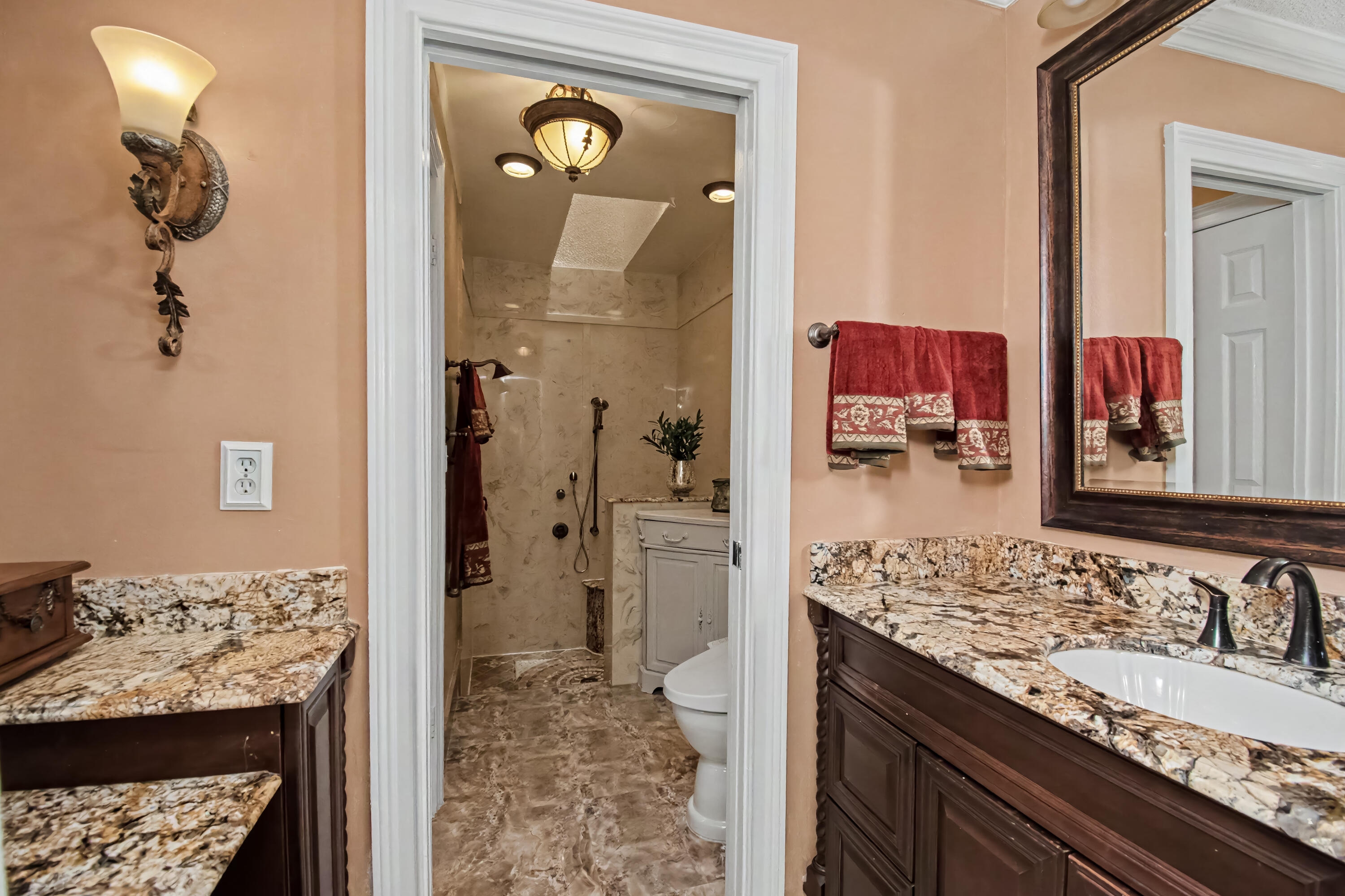 9708 Erica Court Boca Raton, FL 33496 - Photo 31 of 54 a bathroom with a granite countertop sink and a mirror
