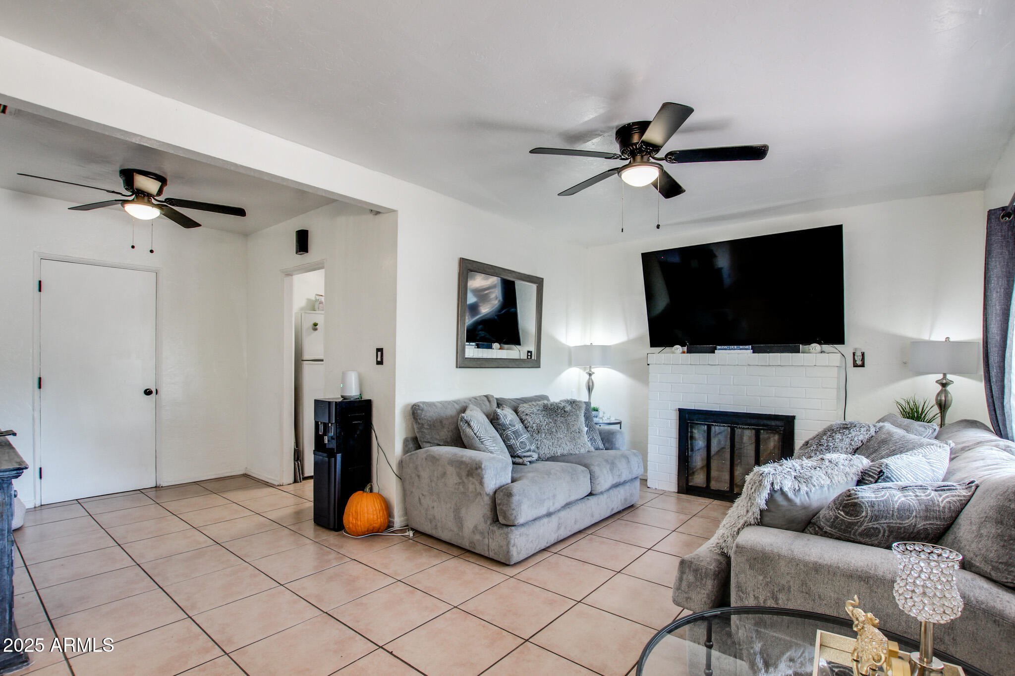 3273 East 27th Street Tucson, AZ 85713 - Photo 15 of 39 a living room with furniture and a flat screen tv