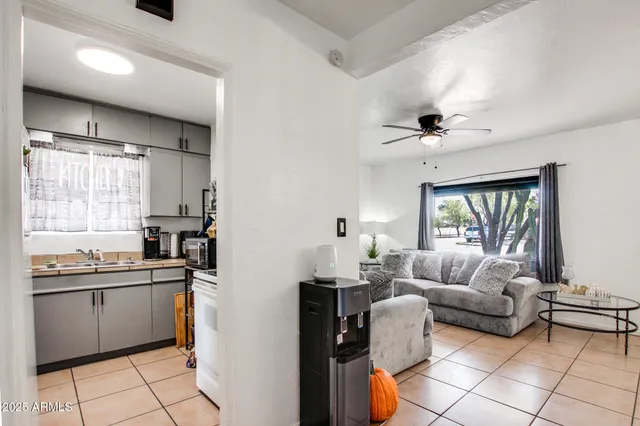 a kitchen with stainless steel appliances granite countertop a sink and a refrigerator