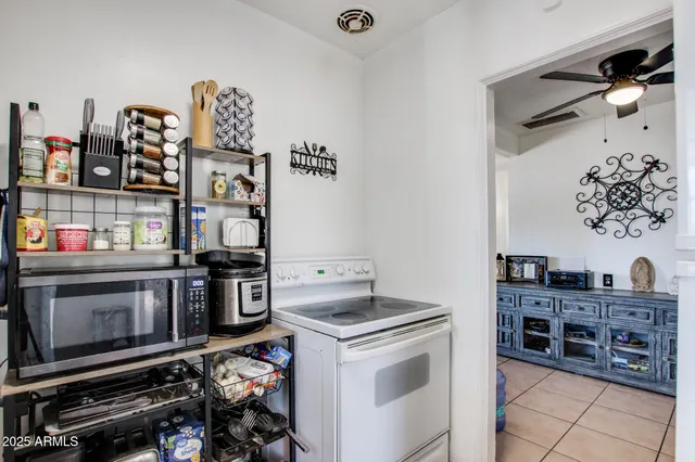 a kitchen with stainless steel appliances a stove and a refrigerator