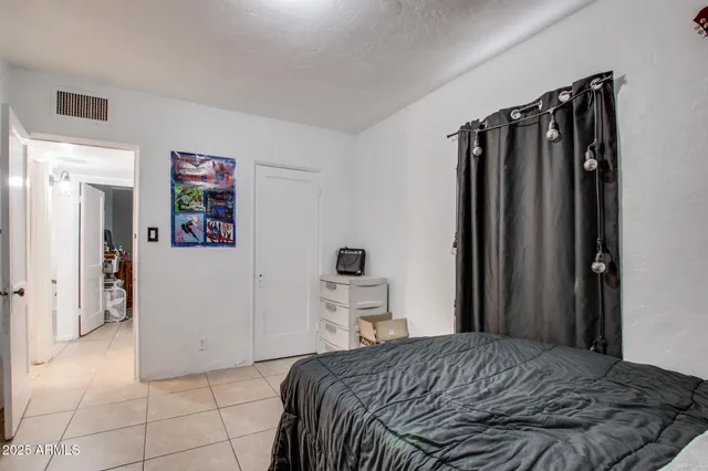 a bedroom with a bed and cabinets
