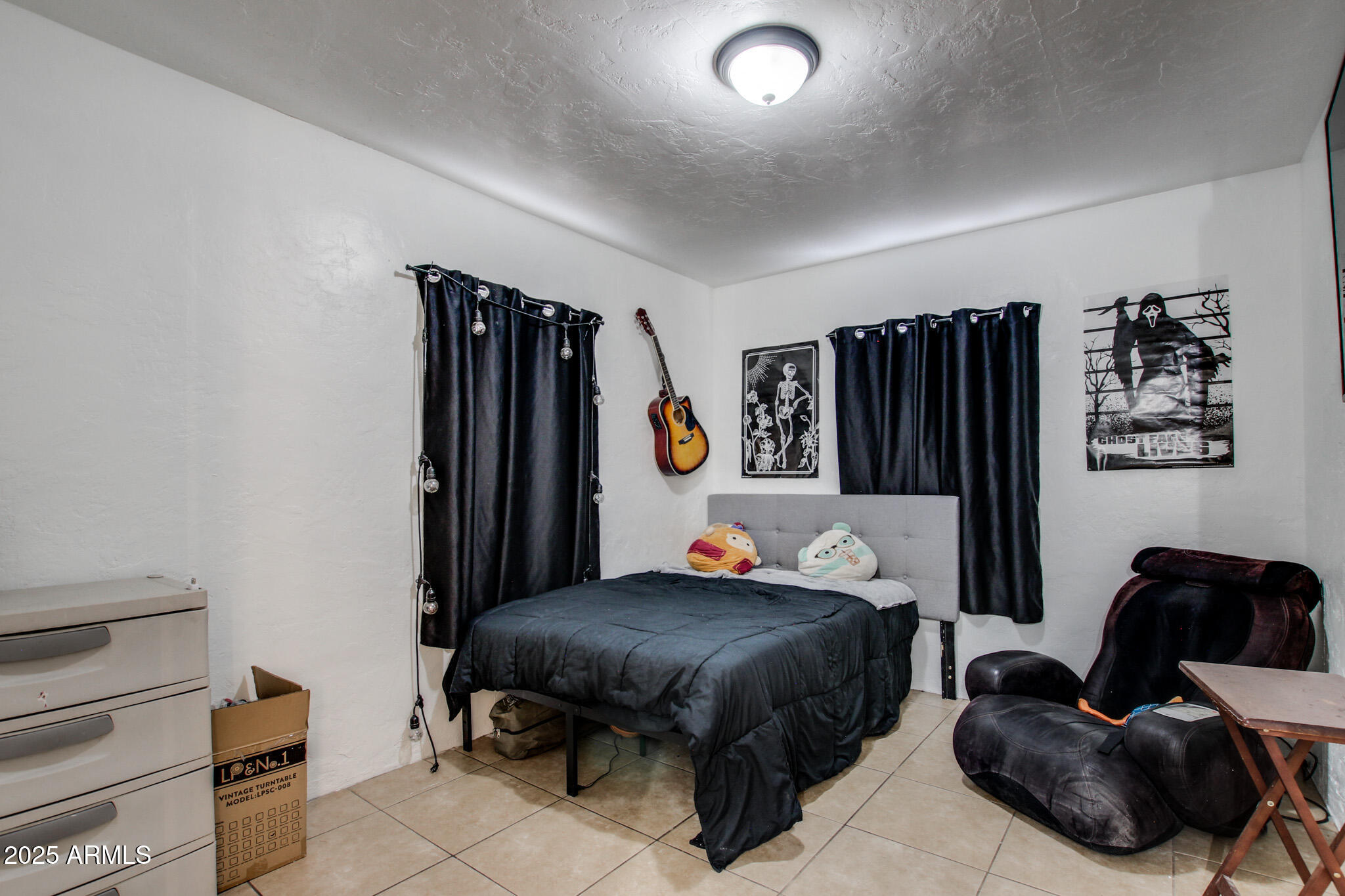 3273 East 27th Street Tucson, AZ 85713 - Photo 22 of 39 a bedroom with a bed and dresser