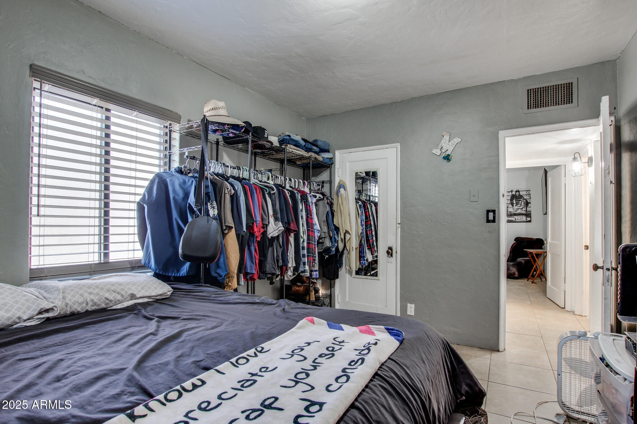 3273 East 27th Street Tucson, AZ 85713 - Photo 24 of 39 a bed room with a bed and a window