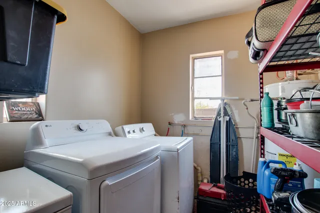 a utility room with dryer and washer