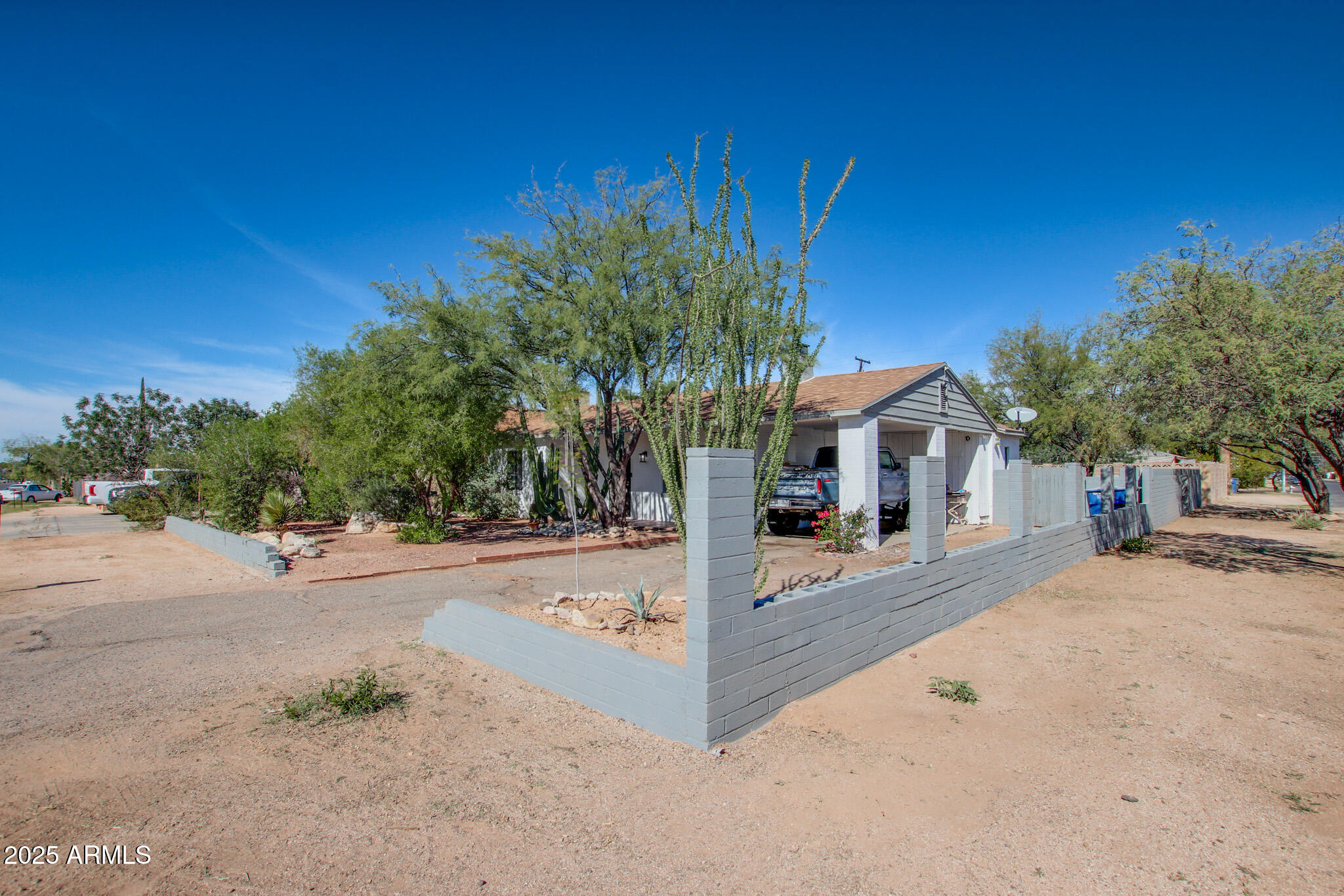 3273 East 27th Street Tucson, AZ 85713 - Photo 36 of 39 a front view of a house with a yard