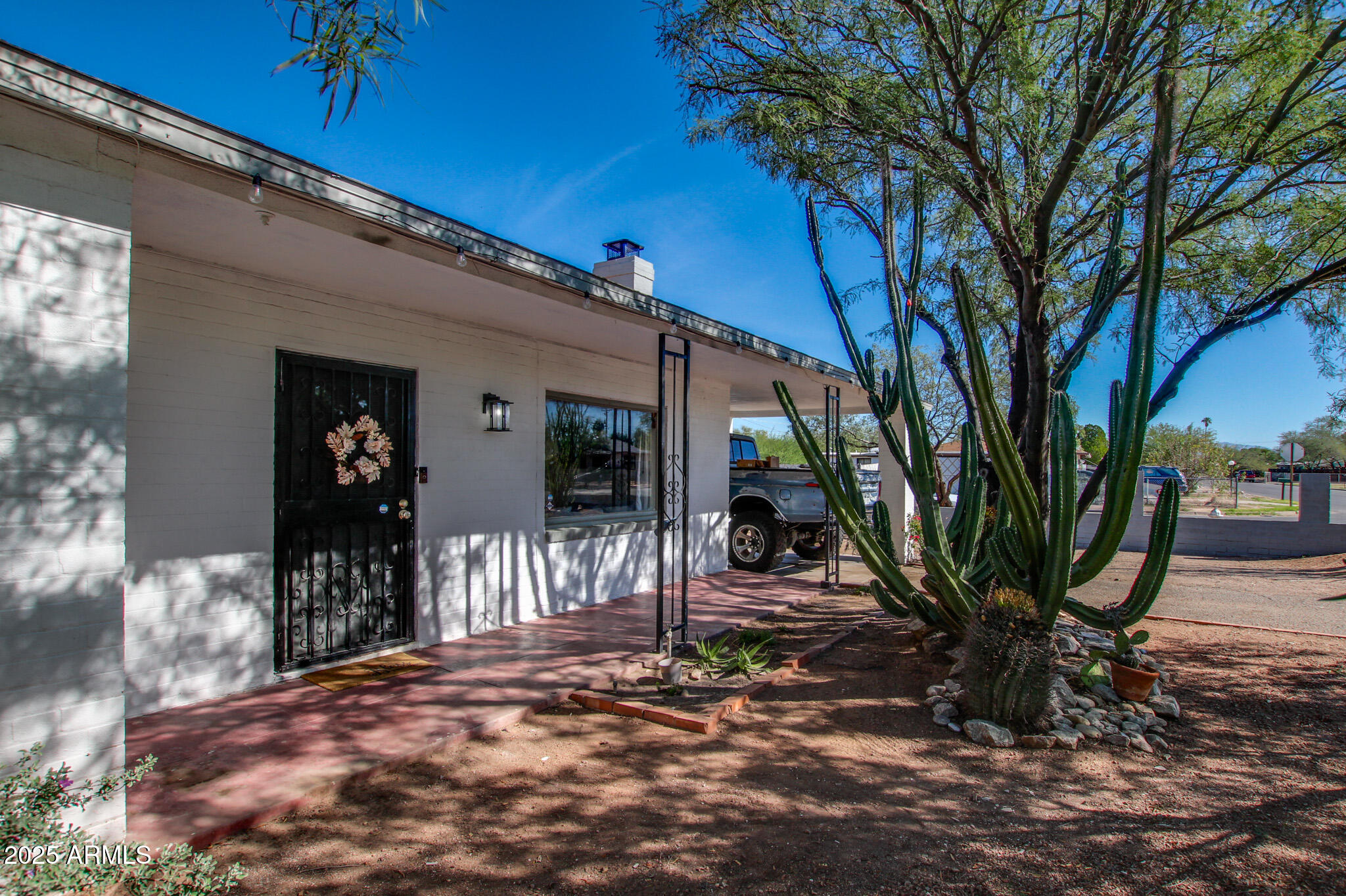 3273 East 27th Street Tucson, AZ 85713 - Photo 6 of 39 a view of a patio with table and chairs and potted plants