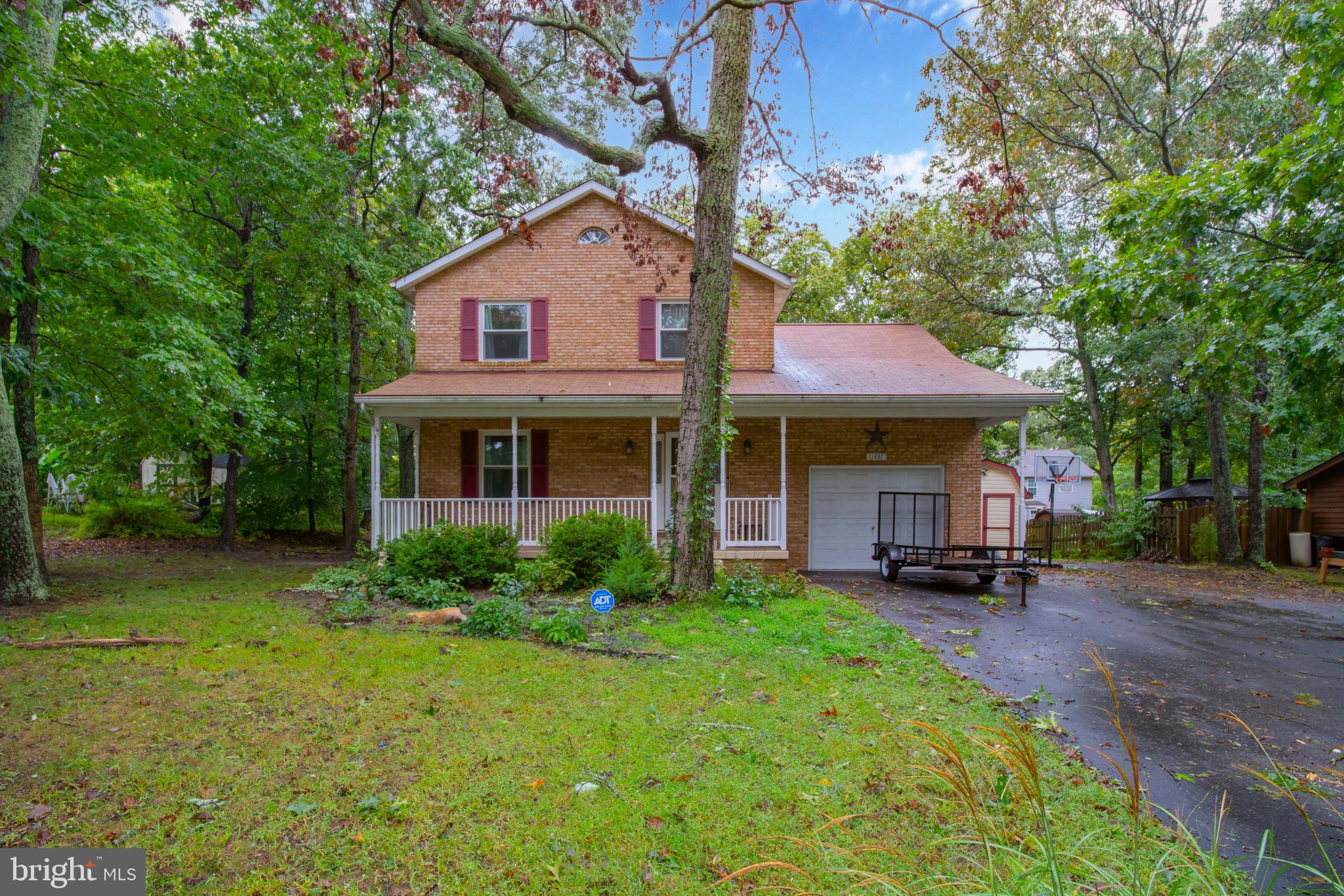 11431 Rawhide Road Lusby, MD 20657 - Photo 1 of 31 a view of a yard in front of house