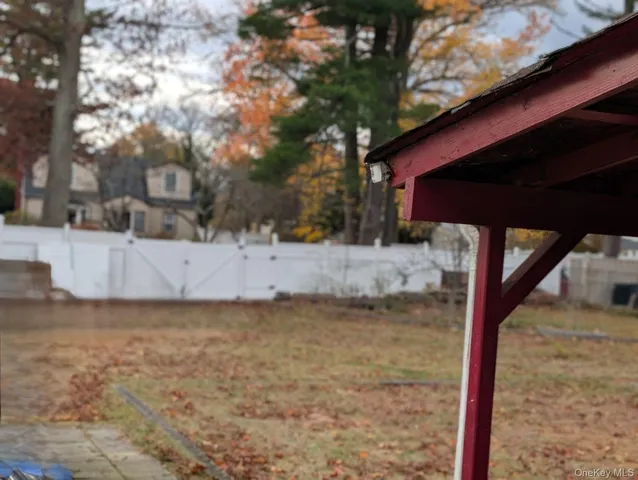a living room with furniture and a lamp